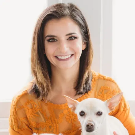 Theresa Pancotto holding two dogs